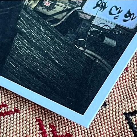Corner of a photo printed on Gentle SM paper, showing its texture and white edge.