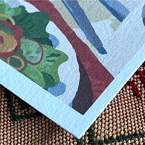 Corner of a photo printed on Old Mill paper, showing its texture and white edge.