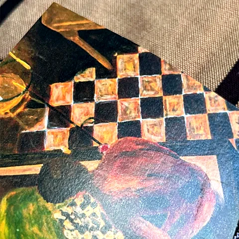 Corner of a photo printed on Smooth Matte Laminated paper, showing its texture and white edge.