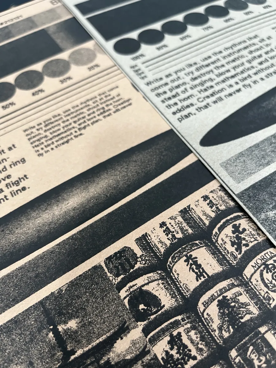 RISO-printed zine pages with black halftone photos and small text on cream paper